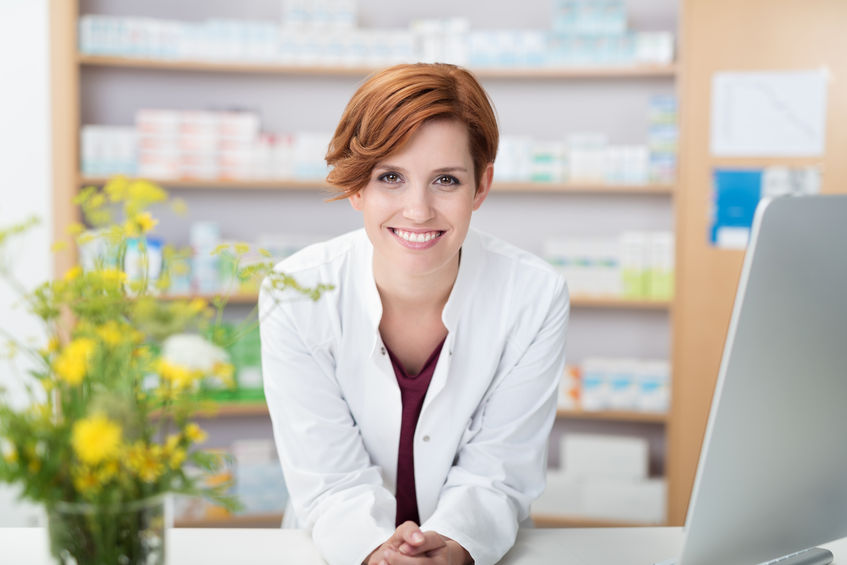 Smiling pharmacist. Click to learn about Medicare Drug plans.